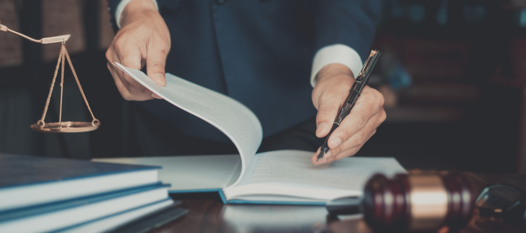 A person reviewing a legal document in court