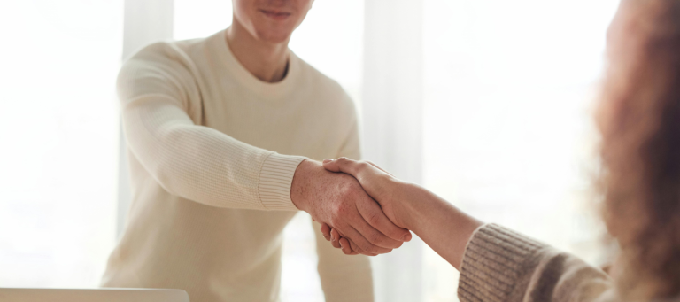 Lawyer and safety professional shaking hands