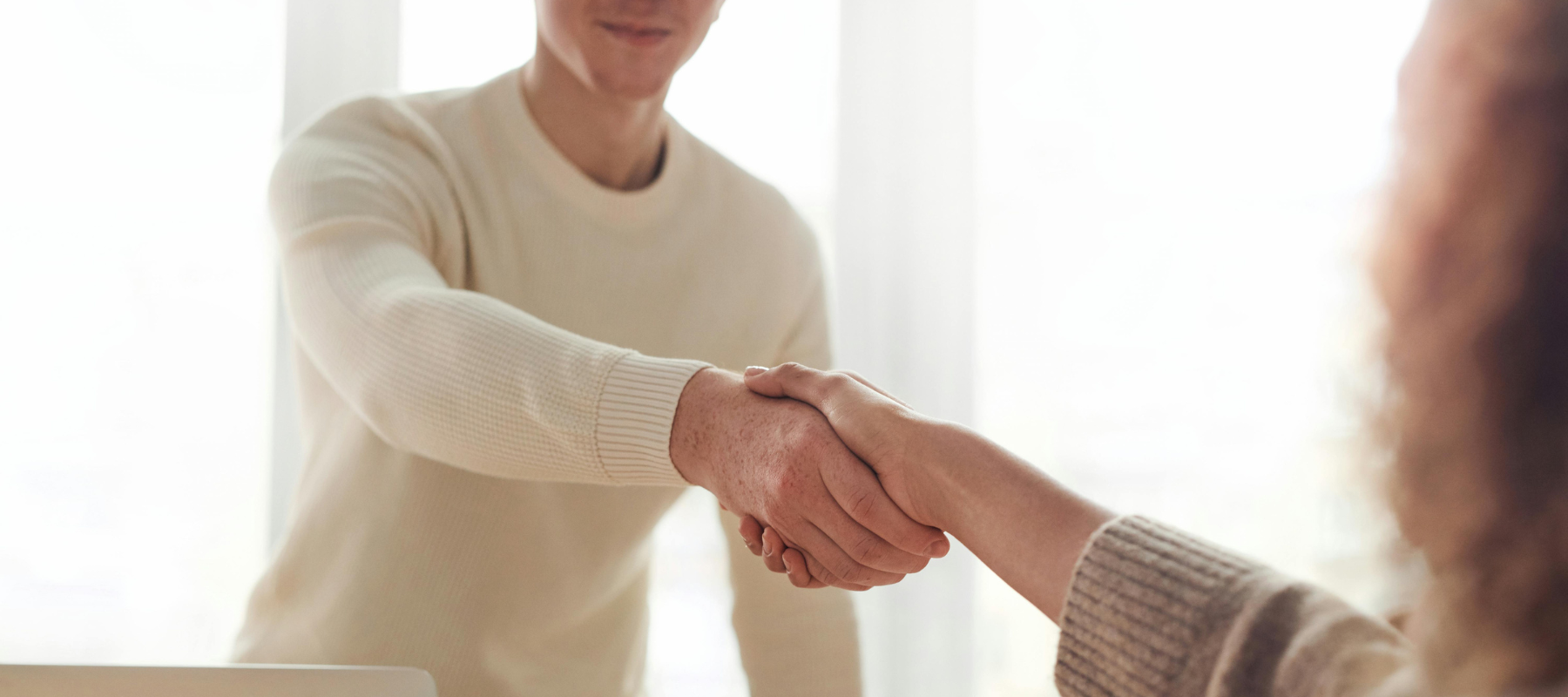 Lawyer and safety professional shaking hands